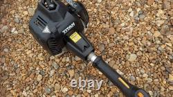 Coupe-brosse Titan Kombi avec débroussailleuse et tronçonneuse sur perche + extension